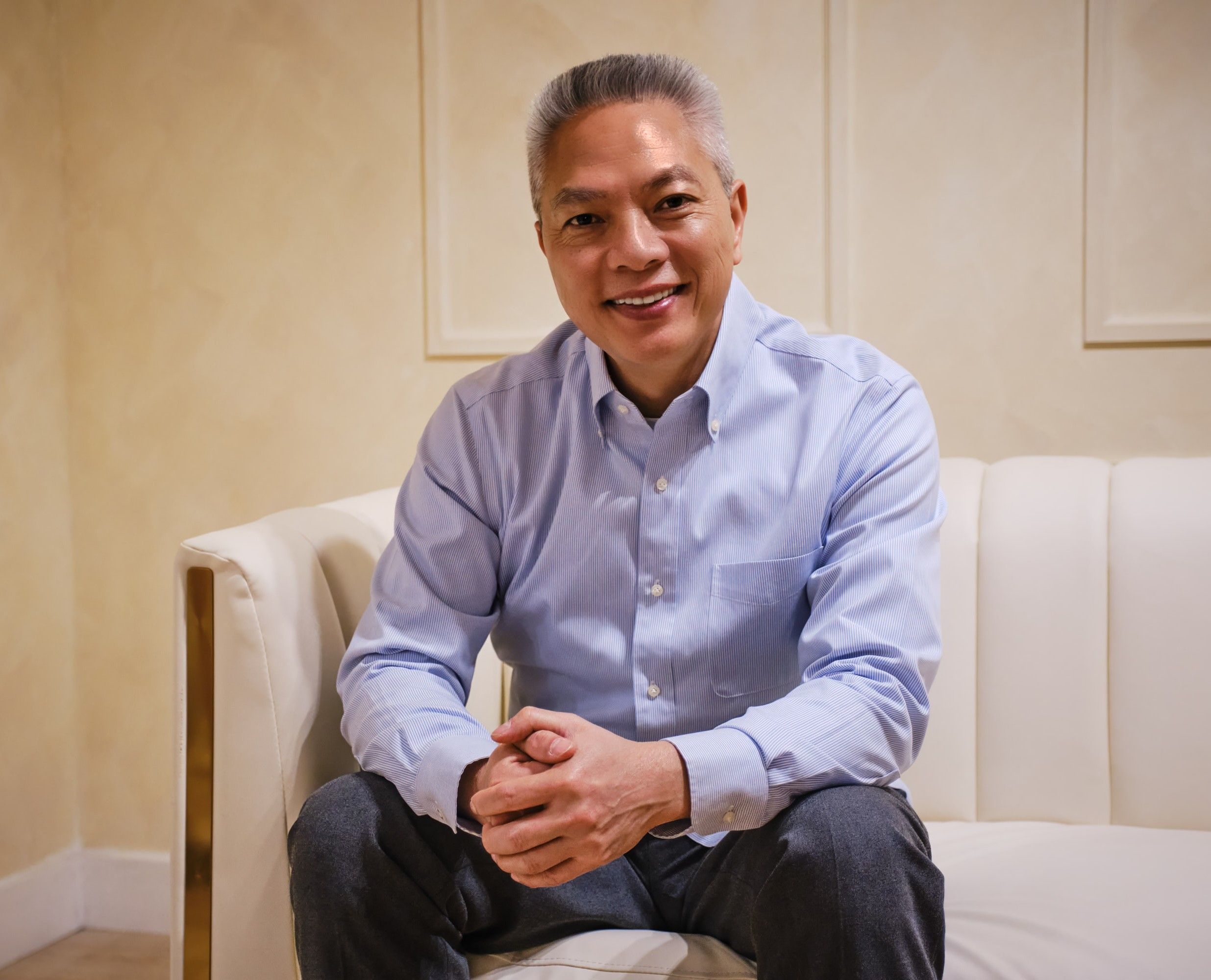 Jeff Thungc seated and smiling toward the camera